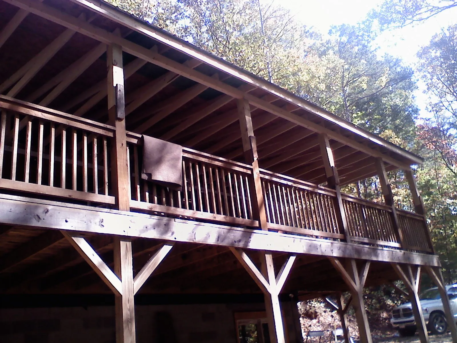 Timber framing under a new elevated porch and deck in Gerton